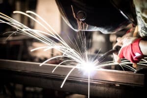 Man-using-mig-mag-welder