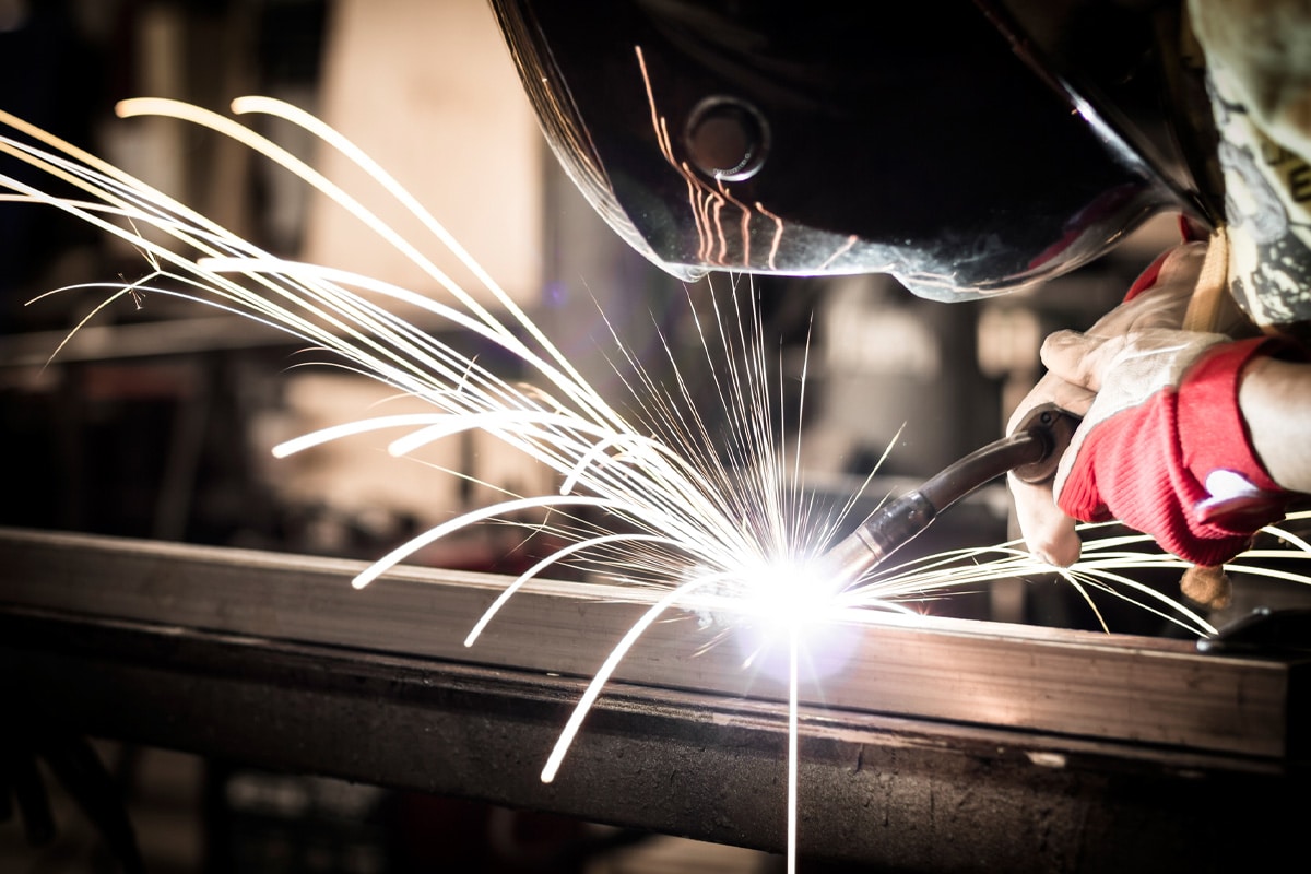 Man-using-mig-mag-welder